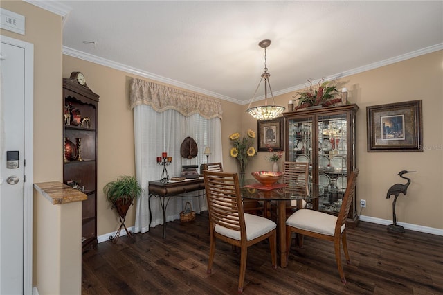 dining area with dark hardwood / wood-style floors, an inviting chandelier, and ornamental molding