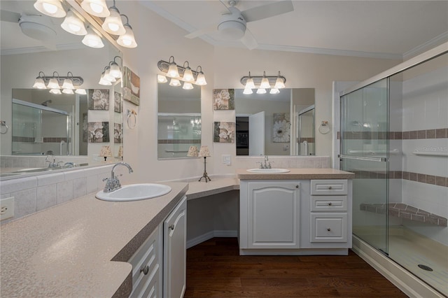 bathroom featuring ceiling fan, crown molding, hardwood / wood-style flooring, and walk in shower