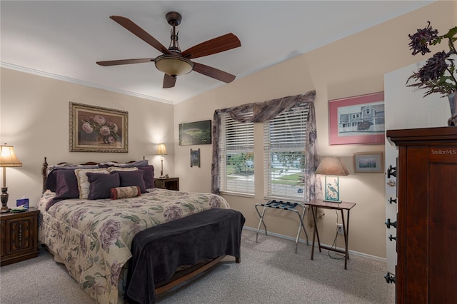 carpeted bedroom with ceiling fan and crown molding