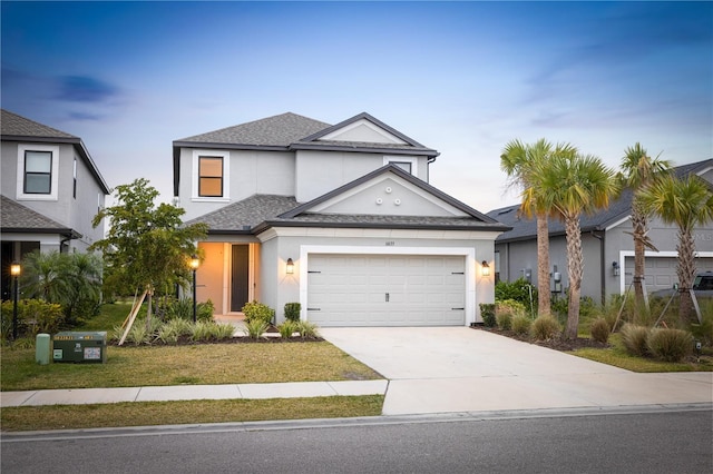 view of front facade featuring a garage and a front lawn