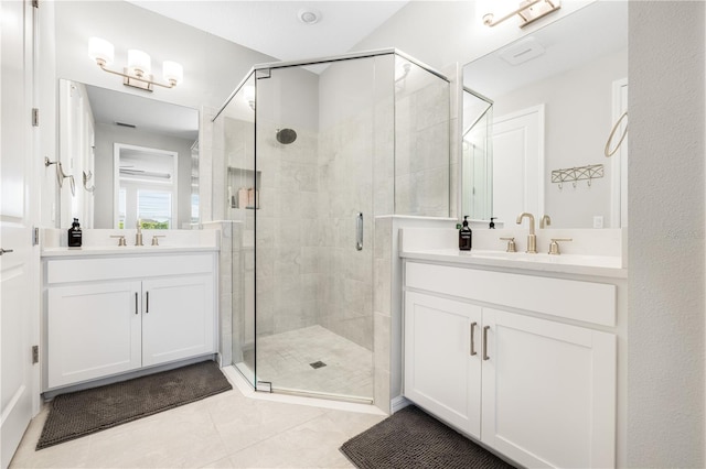 bathroom with walk in shower, tile patterned floors, and vanity