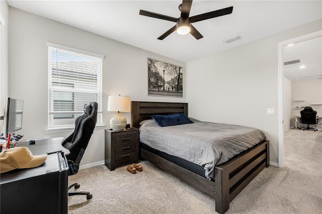 bedroom featuring ceiling fan and light colored carpet