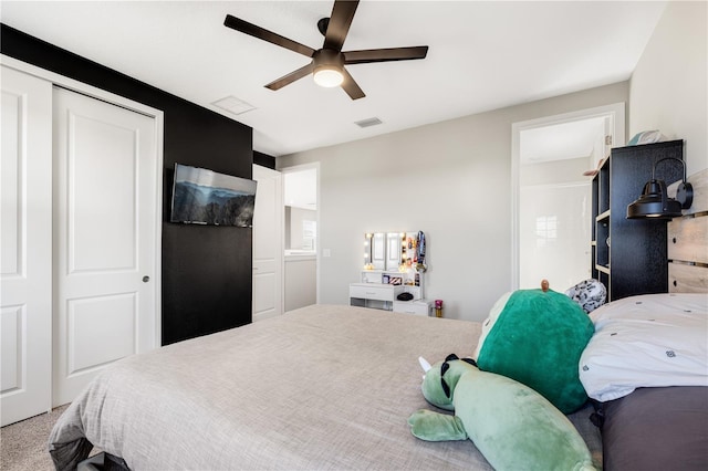 carpeted bedroom with a closet and ceiling fan