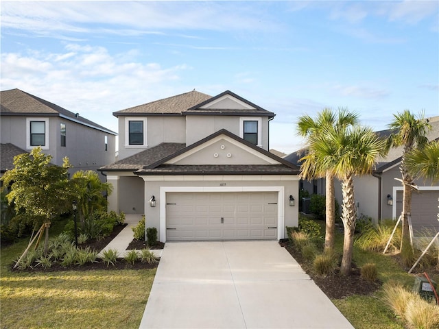 view of front property featuring a garage and a front yard