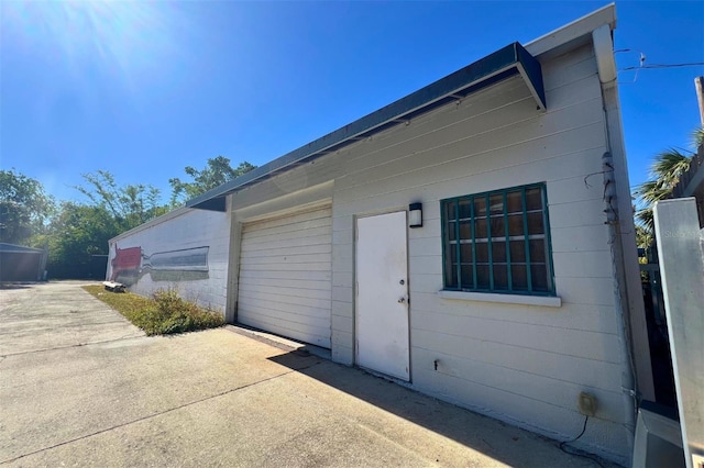 view of side of property with a garage