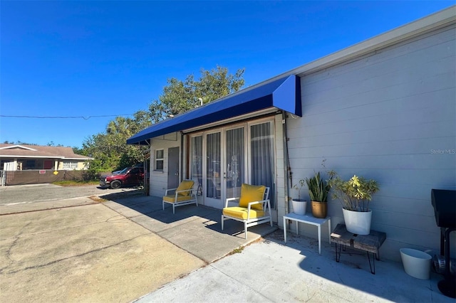 entrance to property with a patio area