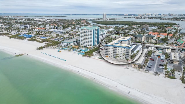 aerial view with a water view and a view of the beach