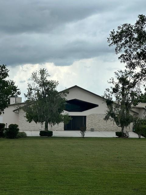 view of side of property with a yard