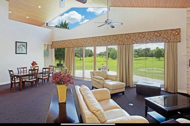 living room with dark colored carpet, high vaulted ceiling, wooden ceiling, and ceiling fan