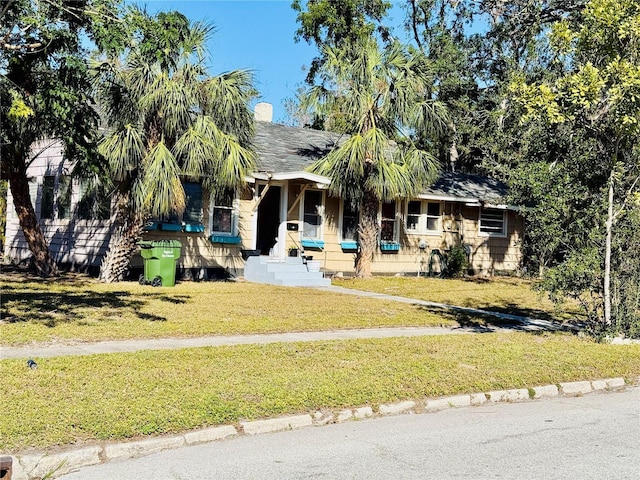 view of front of home with a front lawn