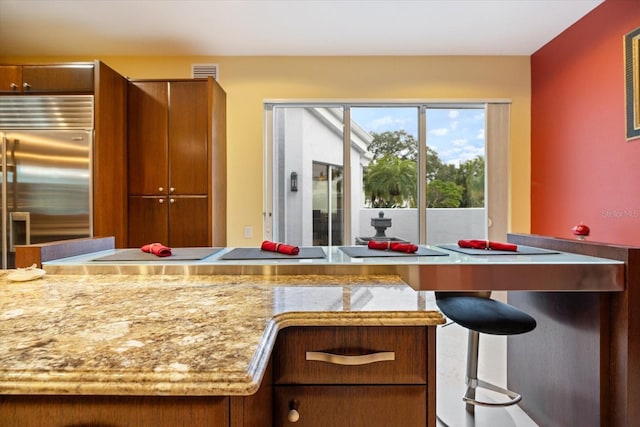 kitchen featuring stainless steel built in fridge