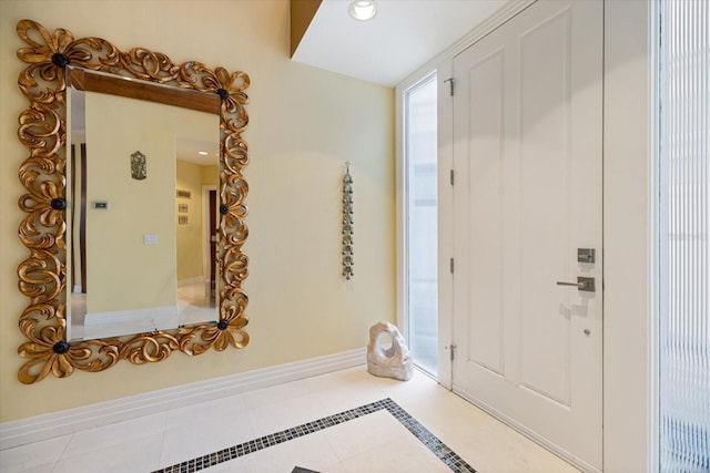 foyer entrance featuring light tile patterned floors