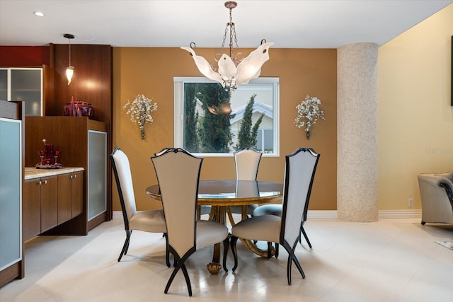 dining space featuring a chandelier