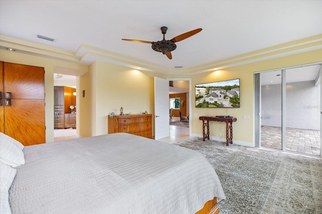 bedroom featuring ceiling fan, access to exterior, and carpet floors