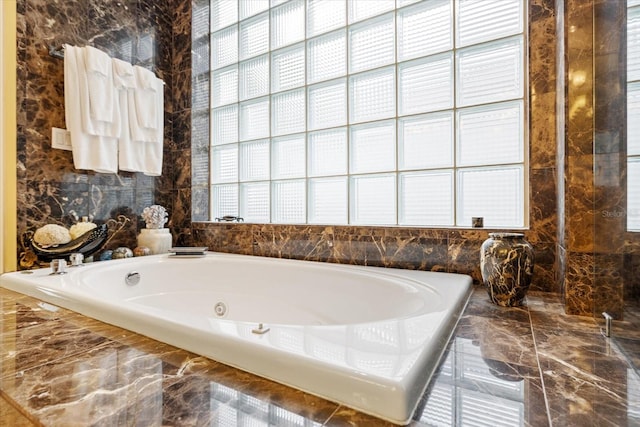 bathroom featuring tiled bath