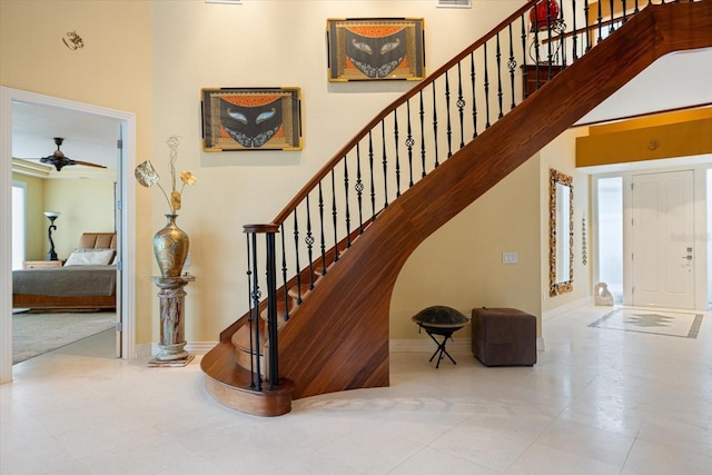 stairs with ceiling fan