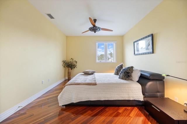 bedroom with ceiling fan and hardwood / wood-style floors