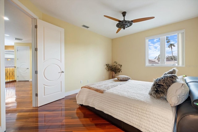 bedroom featuring ceiling fan and dark hardwood / wood-style flooring