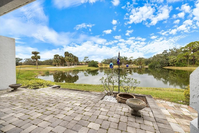 view of patio with a water view