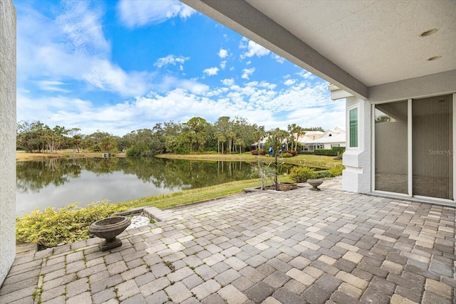 view of patio / terrace featuring a water view