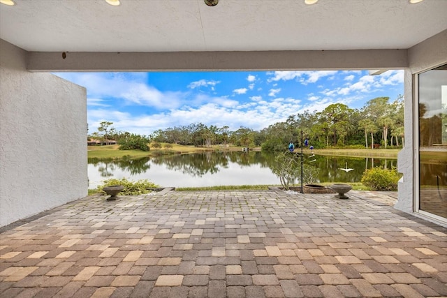 view of patio / terrace with a water view