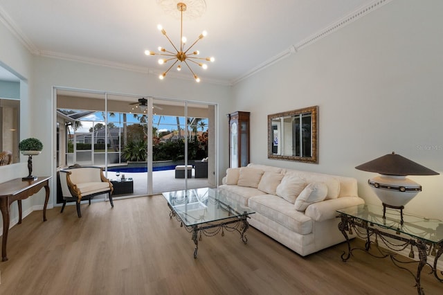 living room featuring a notable chandelier, crown molding, and hardwood / wood-style flooring