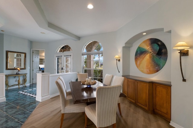 dining area with dark wood-type flooring