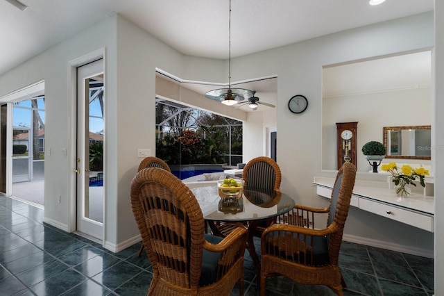 dining space with ceiling fan