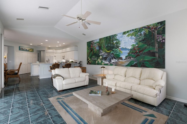 living room featuring vaulted ceiling and ceiling fan