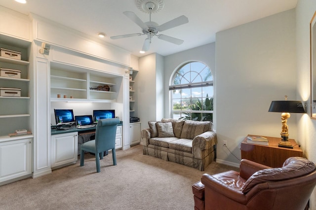 carpeted home office with ceiling fan