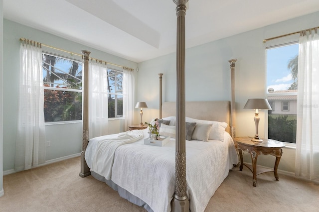 bedroom featuring light colored carpet