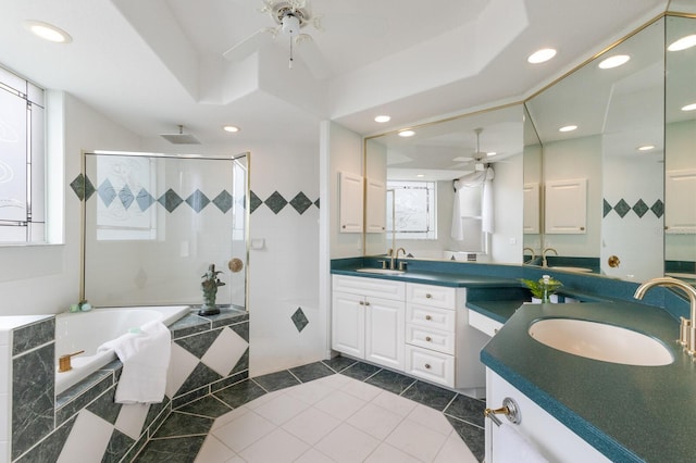 bathroom with ceiling fan, vanity, and shower with separate bathtub