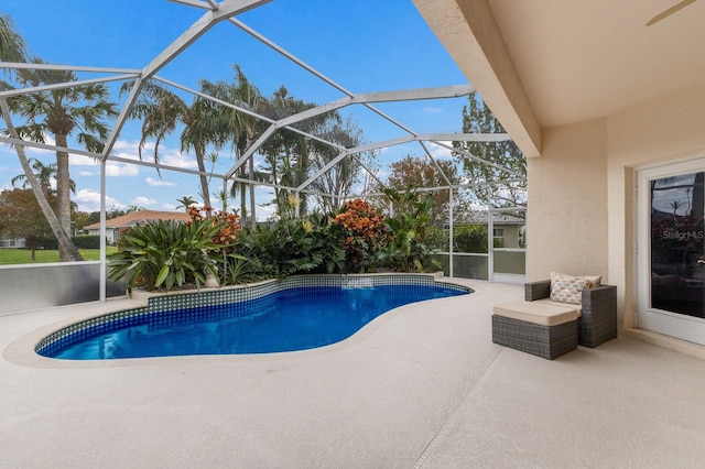 view of pool featuring a lanai and a patio area