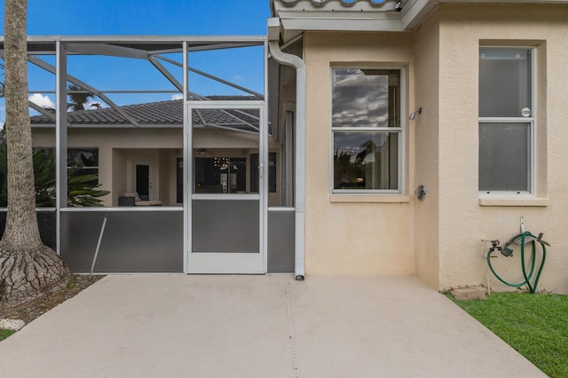 entrance to property featuring a patio