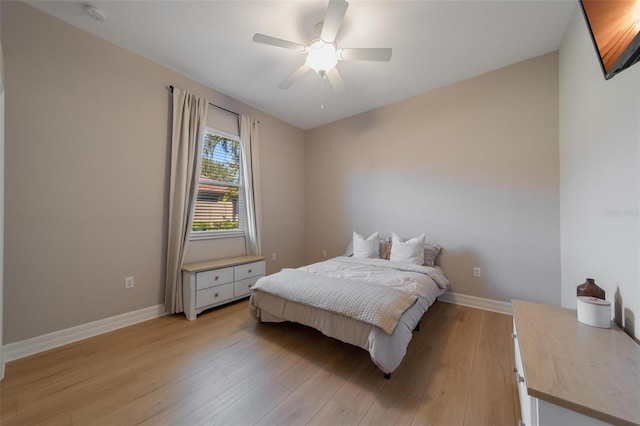 bedroom featuring ceiling fan and light hardwood / wood-style flooring