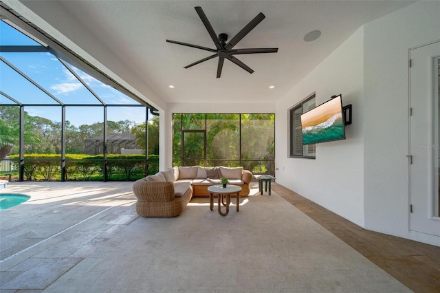 sunroom featuring ceiling fan