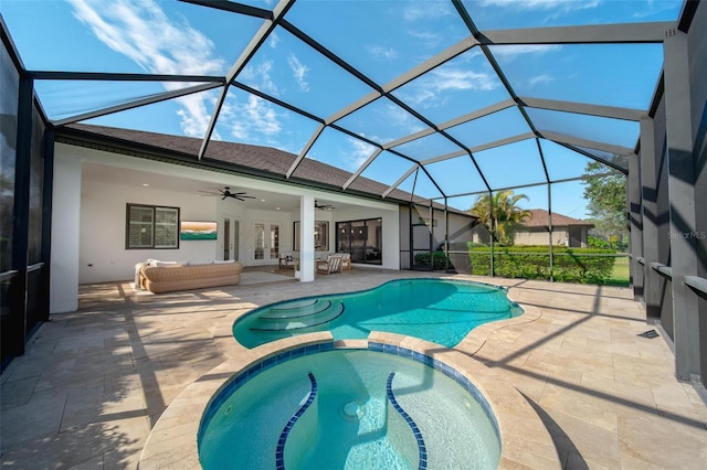 view of pool featuring an outdoor hangout area, an in ground hot tub, ceiling fan, a lanai, and a patio area