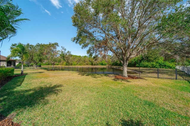 view of yard featuring a rural view and a water view