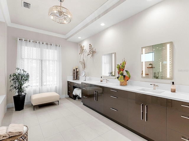 bathroom featuring vanity, an inviting chandelier, and walk in shower