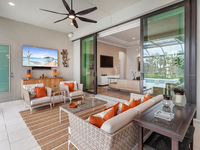 living room featuring ornamental molding and ceiling fan