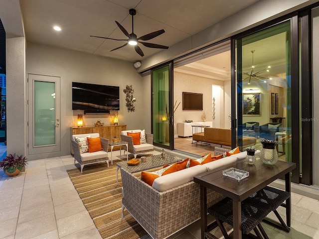 view of patio / terrace with an outdoor living space and ceiling fan