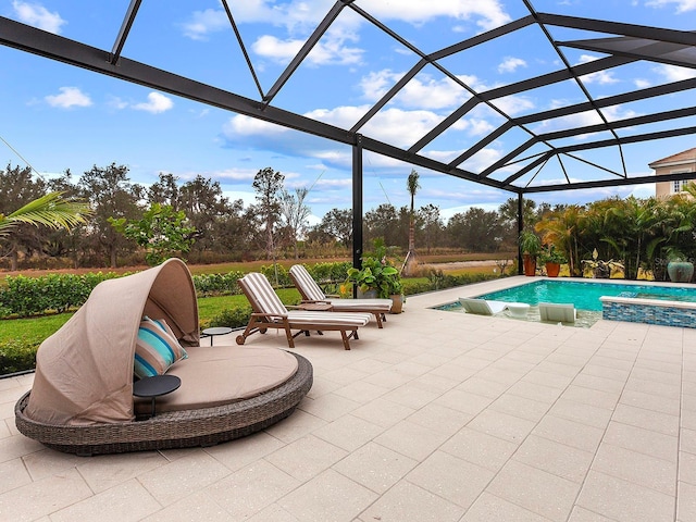 view of swimming pool with a patio and a lanai