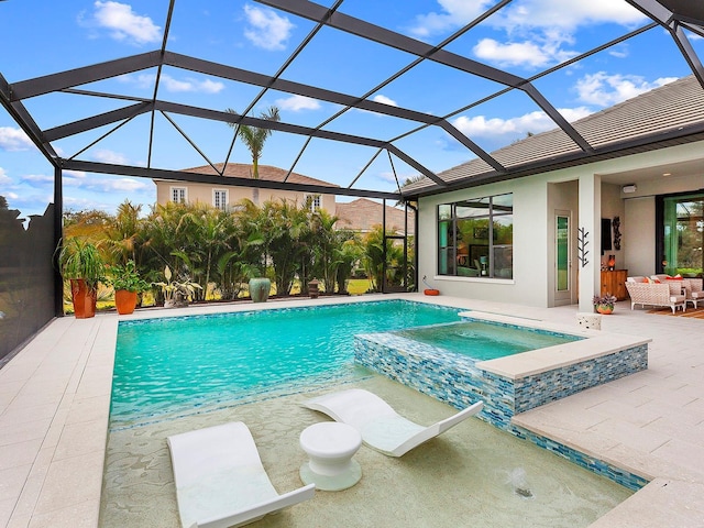 view of pool with an in ground hot tub, a lanai, and a patio area