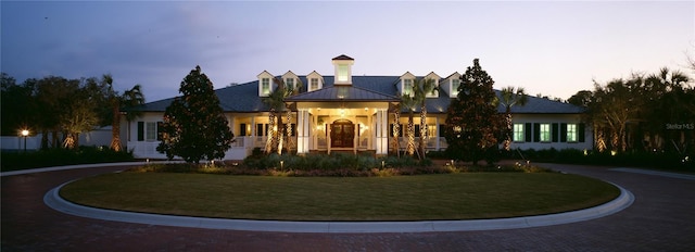 view of front of home with a yard