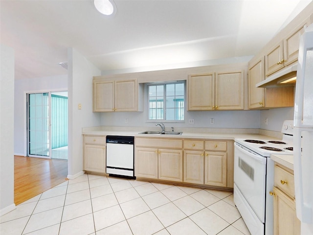 kitchen with sink, light brown cabinets, white appliances, and light tile patterned flooring