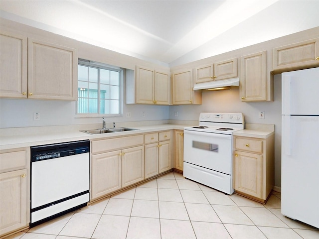 kitchen with white appliances, light tile patterned flooring, lofted ceiling, and sink