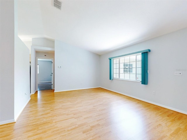 spare room with light hardwood / wood-style flooring