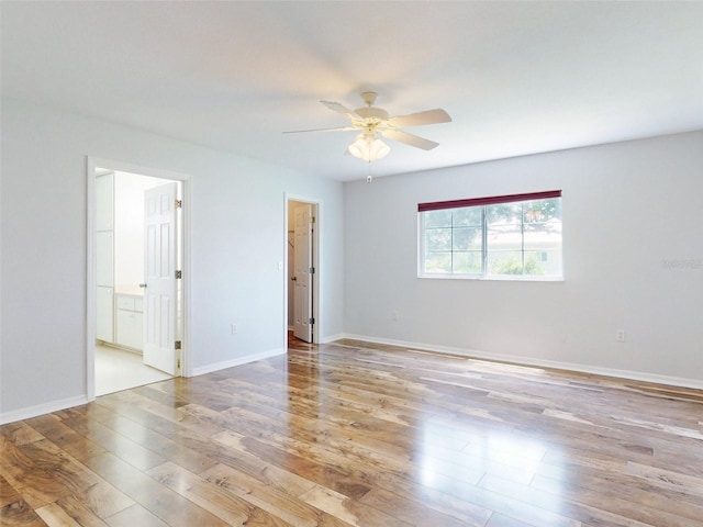 unfurnished room with ceiling fan and light hardwood / wood-style flooring