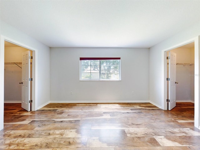 empty room with light hardwood / wood-style flooring