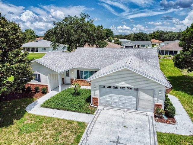 view of front of house featuring a front yard and a garage